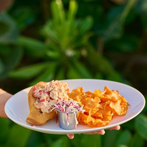 Duryea's Famous lobster roll with sweet potato chips and coleslaw.
