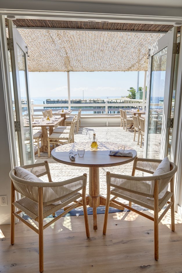 Table for two in the Dining Room at Duryea's Orient Point looking out onto the front deck 