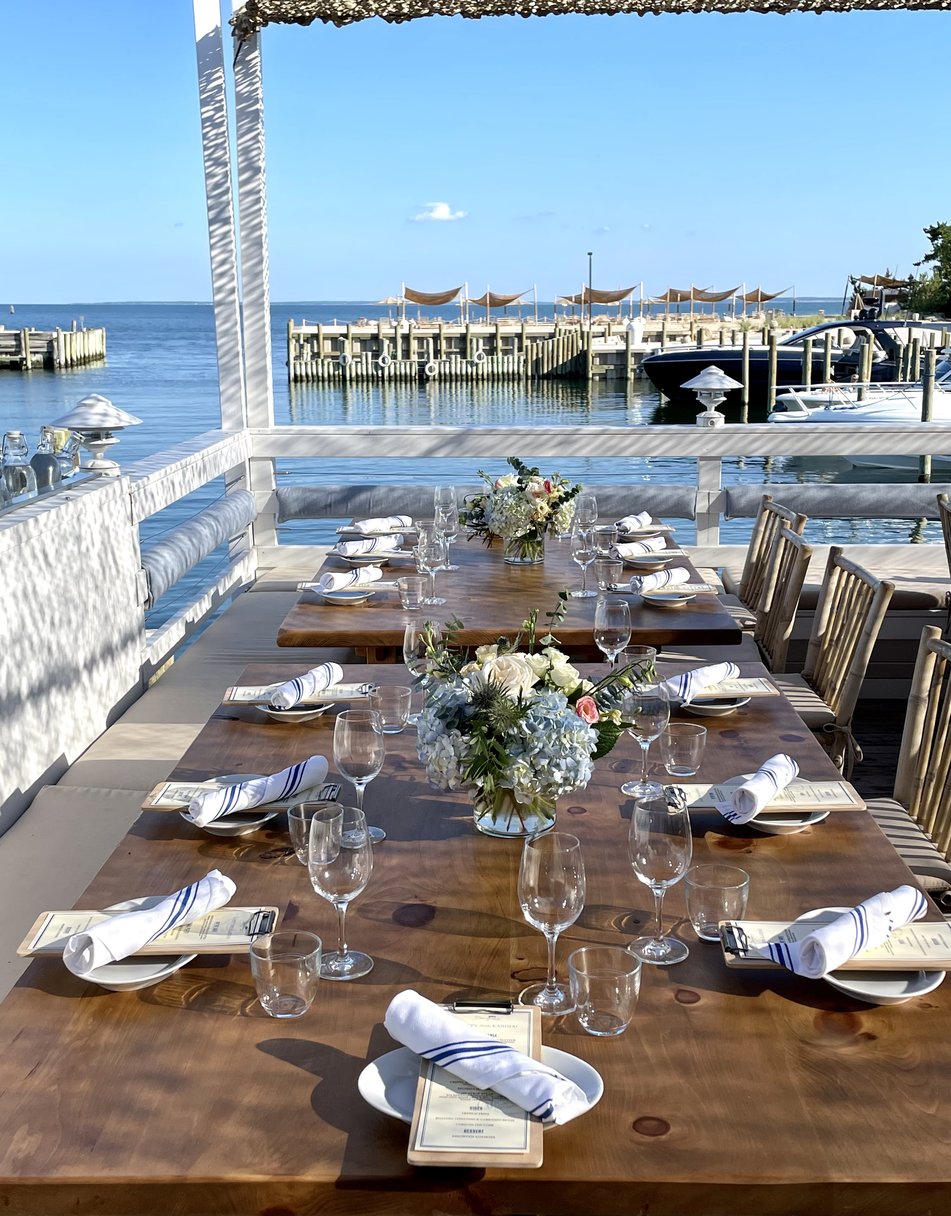 Front deck table at Duryea's Orient Point set for a large group dinner