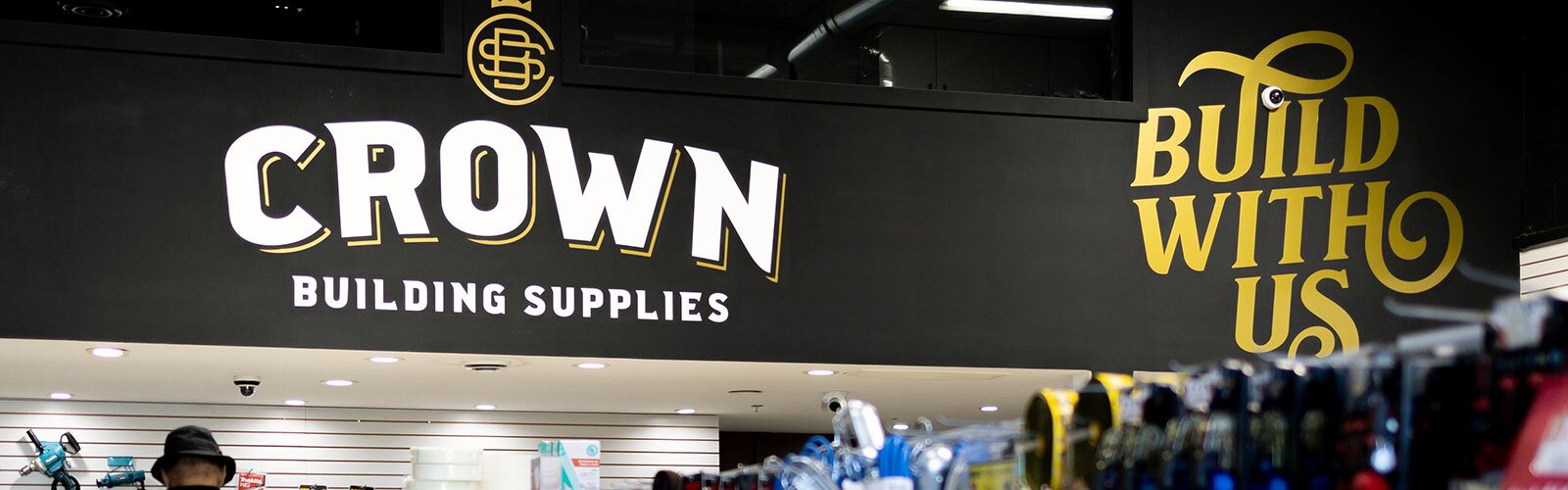 Crown Building Supply store interior with logo
