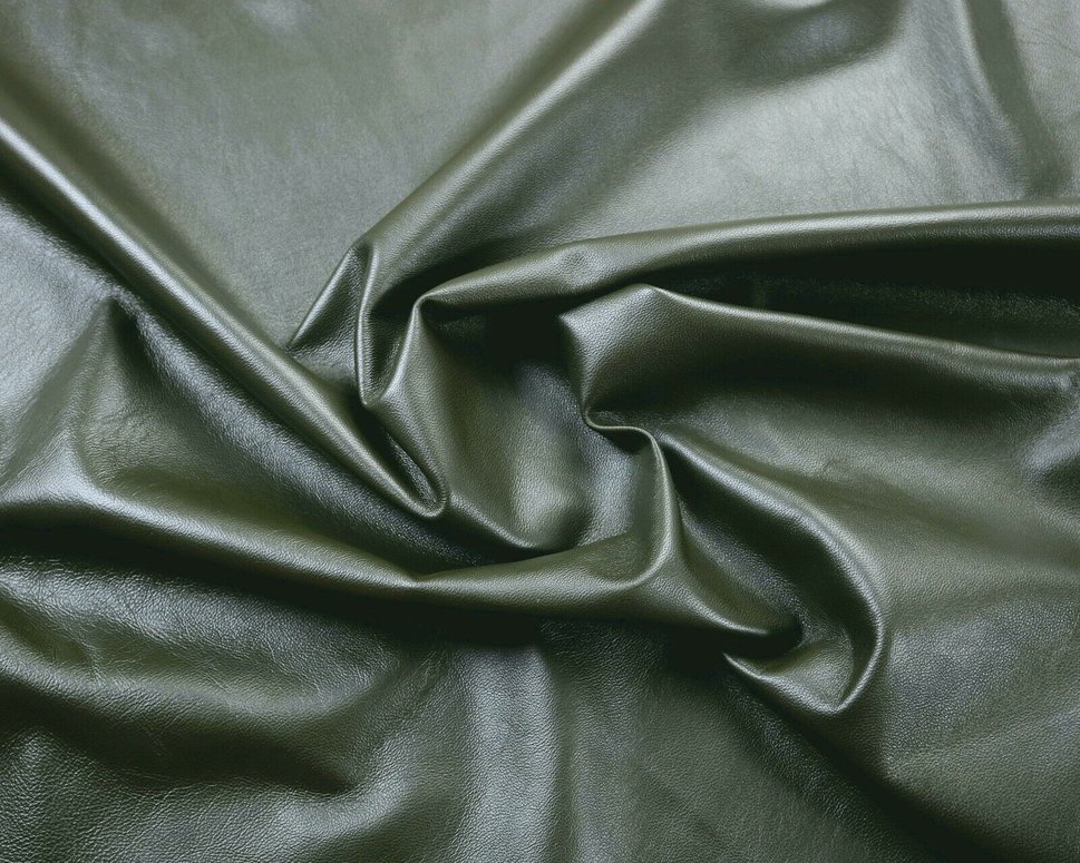 Creaed sheet of dark green Nappa leather
