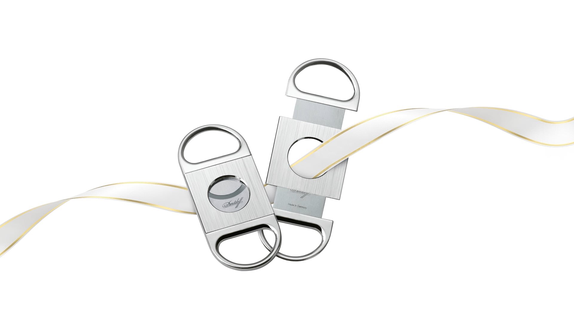 Davidoff-Zigarrenschneider, elegant auf einem weißen Band mit goldenen Akzenten platziert.