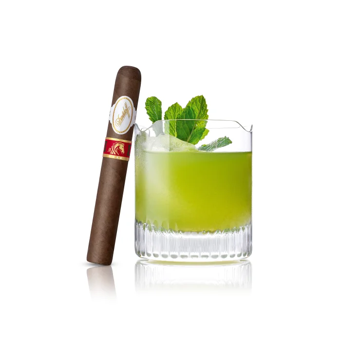 Matcha lemonade with the Year of the Horse cigar next to it.