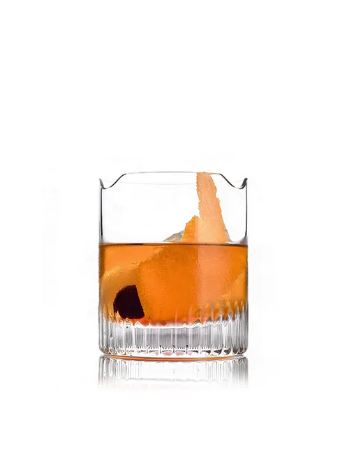 Bourbon Pie cocktail with orange twist and cherry beside a Davidoff Aniversario Double R cigar.