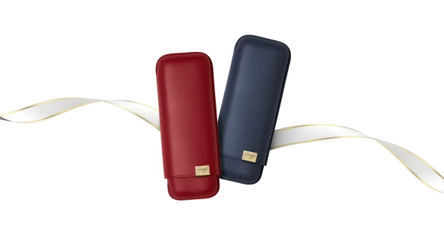 Two Davidoff Punch Cutter Duocut in rose gold placed next to each other with gold/white ribbon in the background.