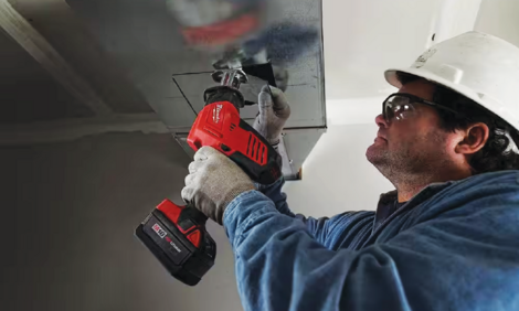 Man working with power tool