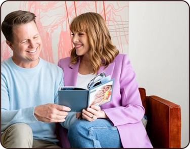 Nate and Vanessa Quigley looking at a Chatbook