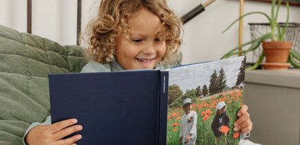 child looking at a chatbook