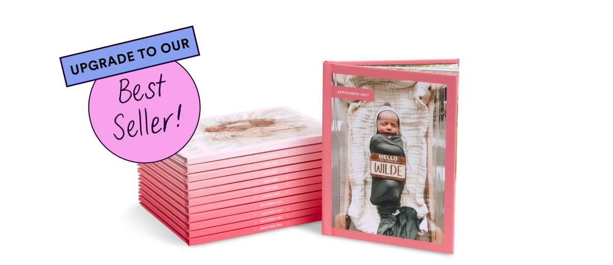Pink ombre baby photo albums by Chatbooks with a swaddled newborn on the cover