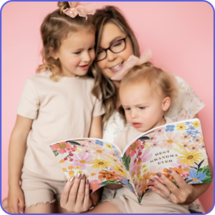 Mother showing her two children a photo book