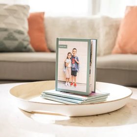 ideas for what to do with school photos you're not sure how to display in picture frames that can't hang at home
