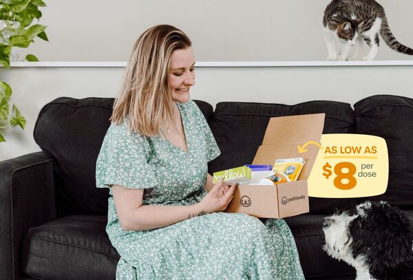 Pet parent with PetFriendly box, "As low as $8/dose!"