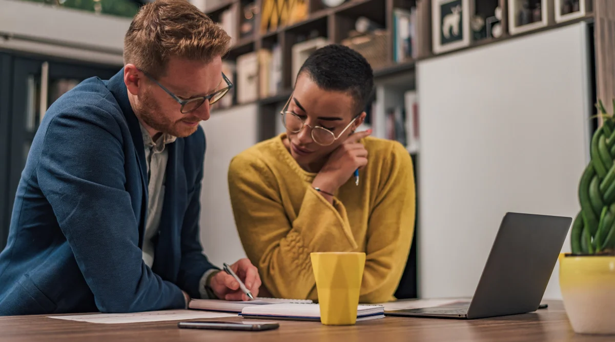 Man talking to a woman during a business meeting