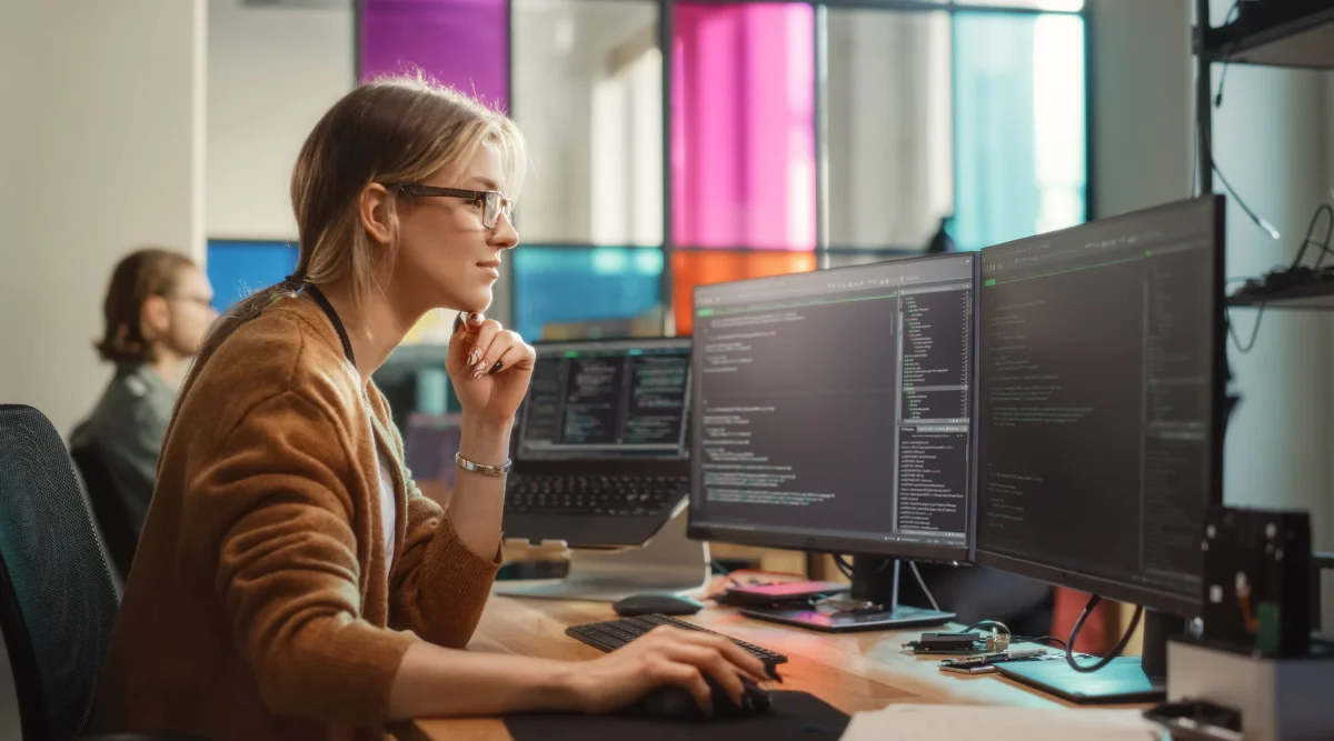 A woman researches tech company names