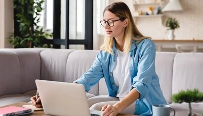A professional woman staring at her computer screen