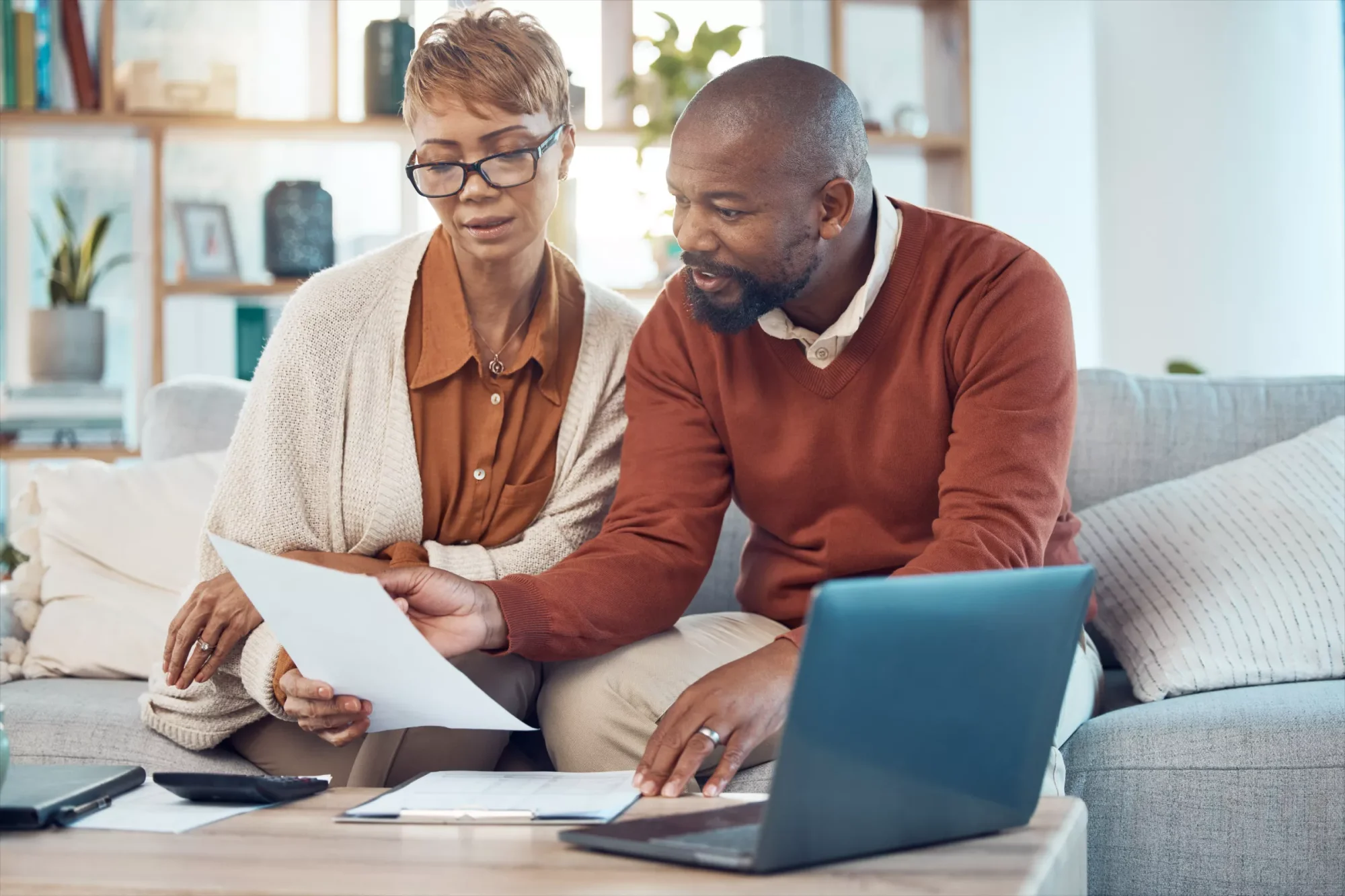 A couple reading a sample of a basic last will and testament, discussing whether a simple will should be good enough for their needs.