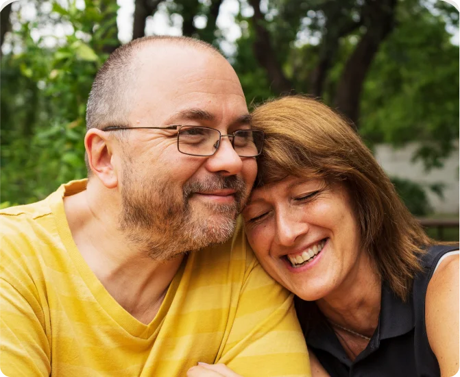 Middle-aged couple embrace in a hug