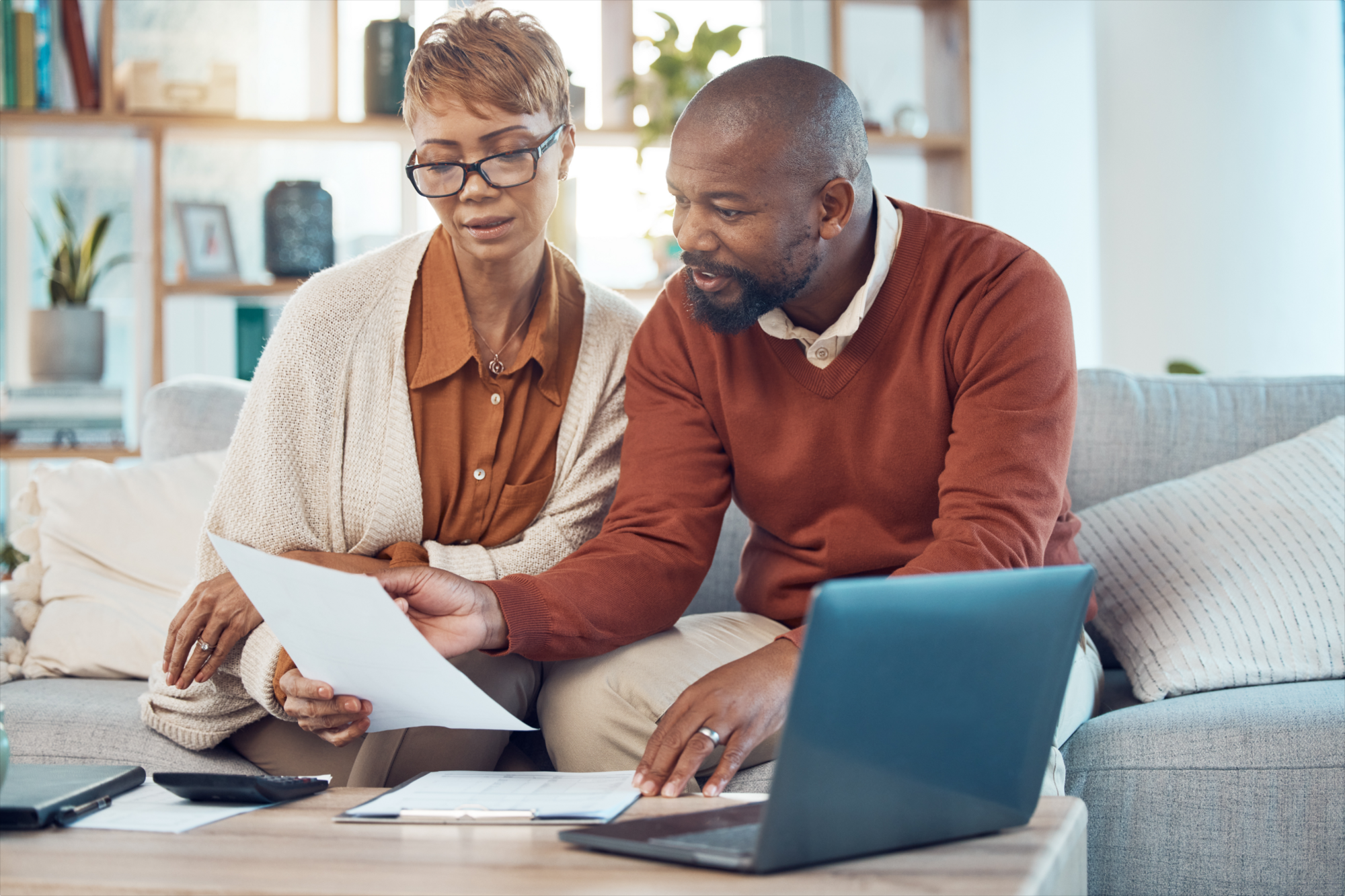 A couple reading a sample of a basic last will and testament, discussing whether a simple will should be good enough for their needs.