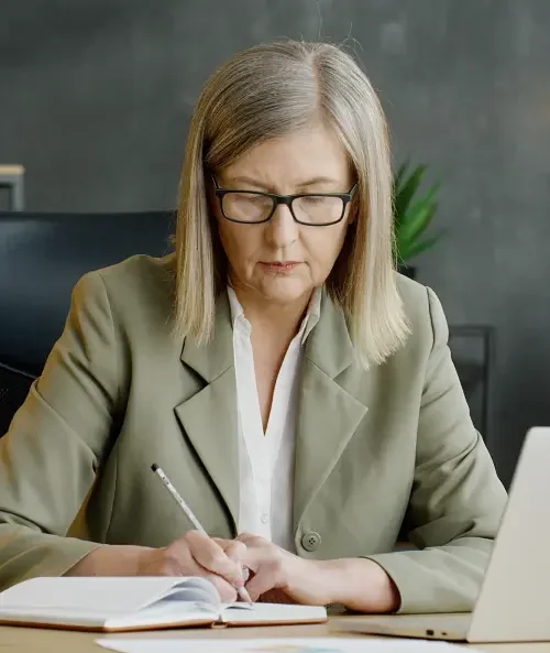 A LegalZoom attorney sitting at her desk in front of a laptop