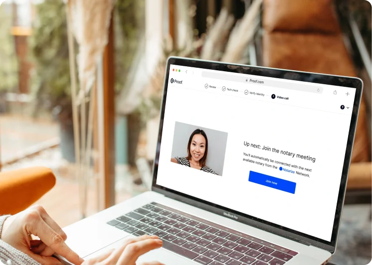 A an image on a laptop of a woman who is available to help with notarization 