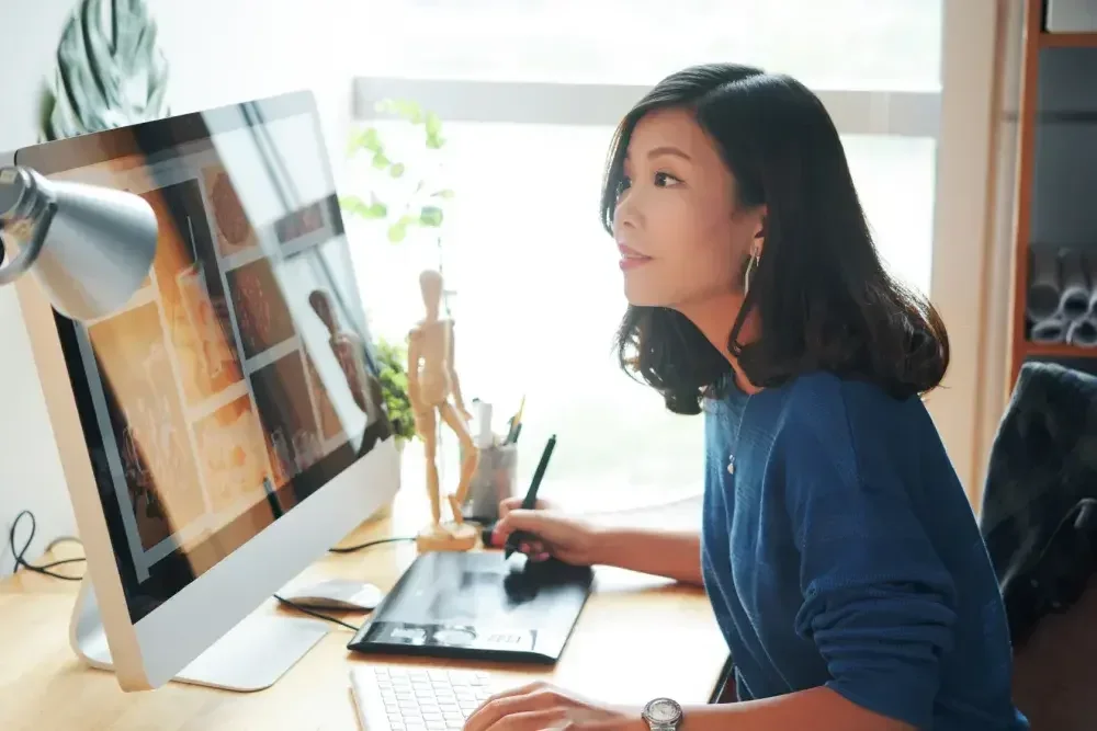 A business owner uses her computer to review specimens for her trademark application.