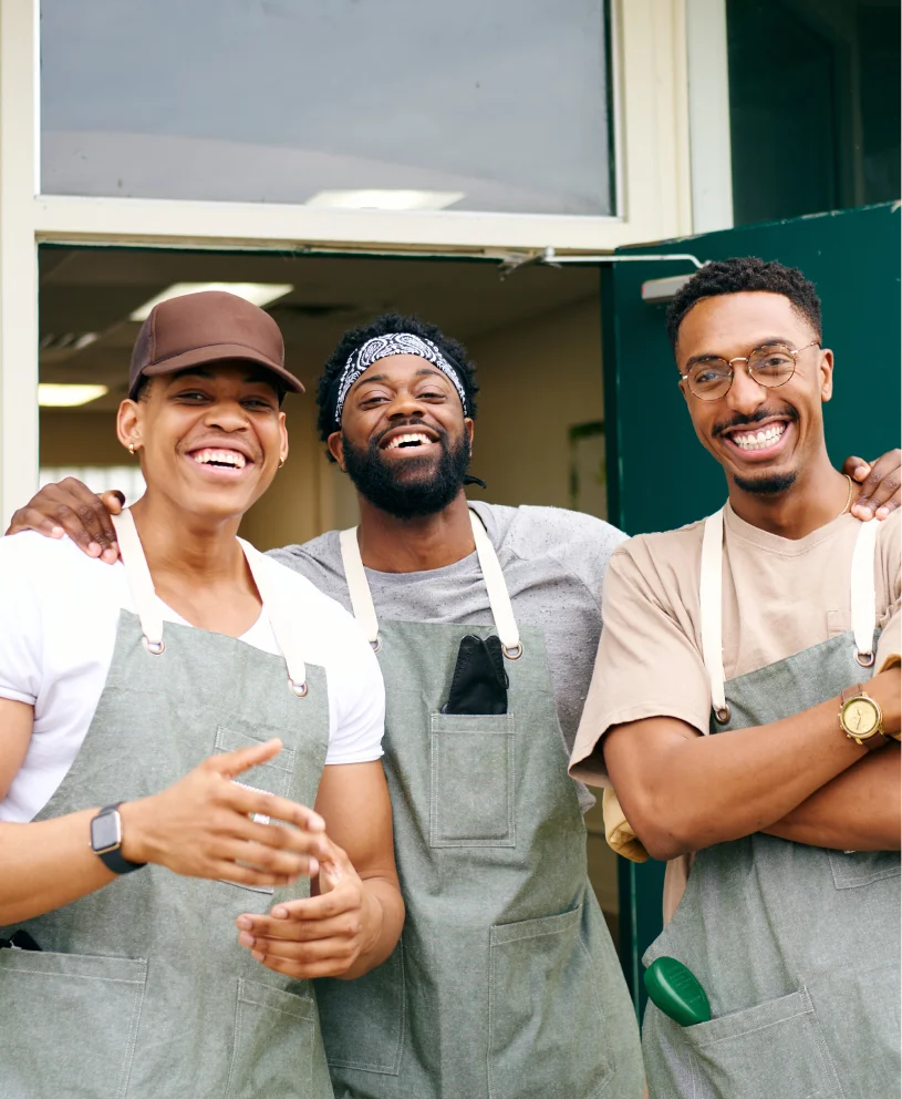 Three men finish up their job in the restaurant. 