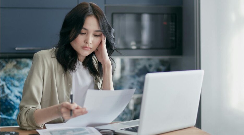An image of a woman who is reading about separate property becoming community property.