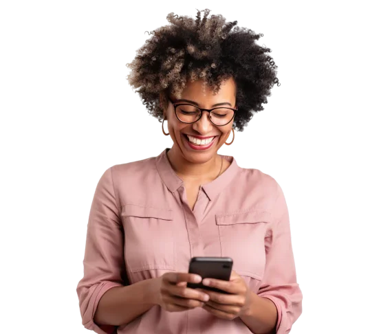 a woman wearing glasses smiles down at her phone