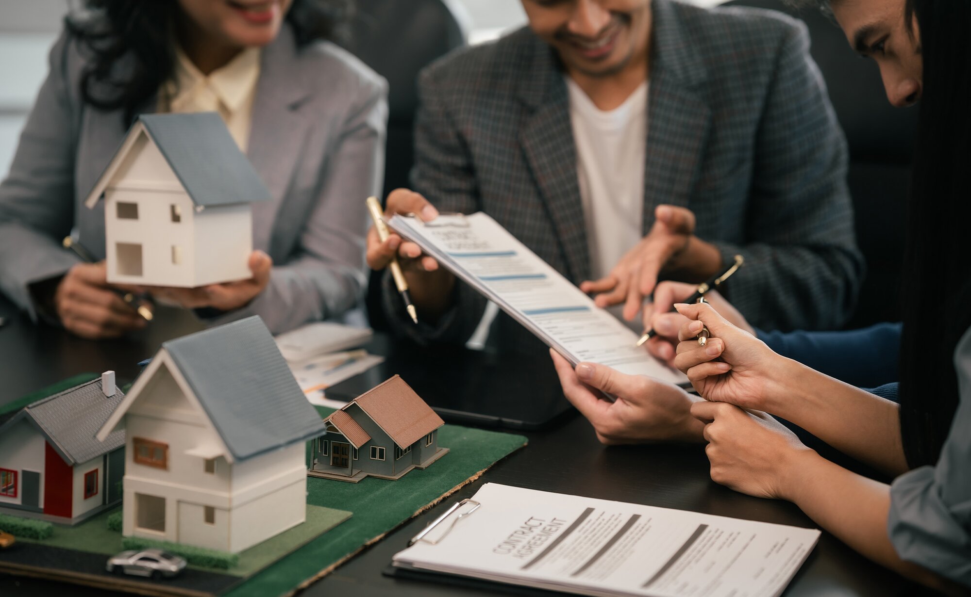 A property manager explaining tenants about the terms and conditions of the property before lease signing.