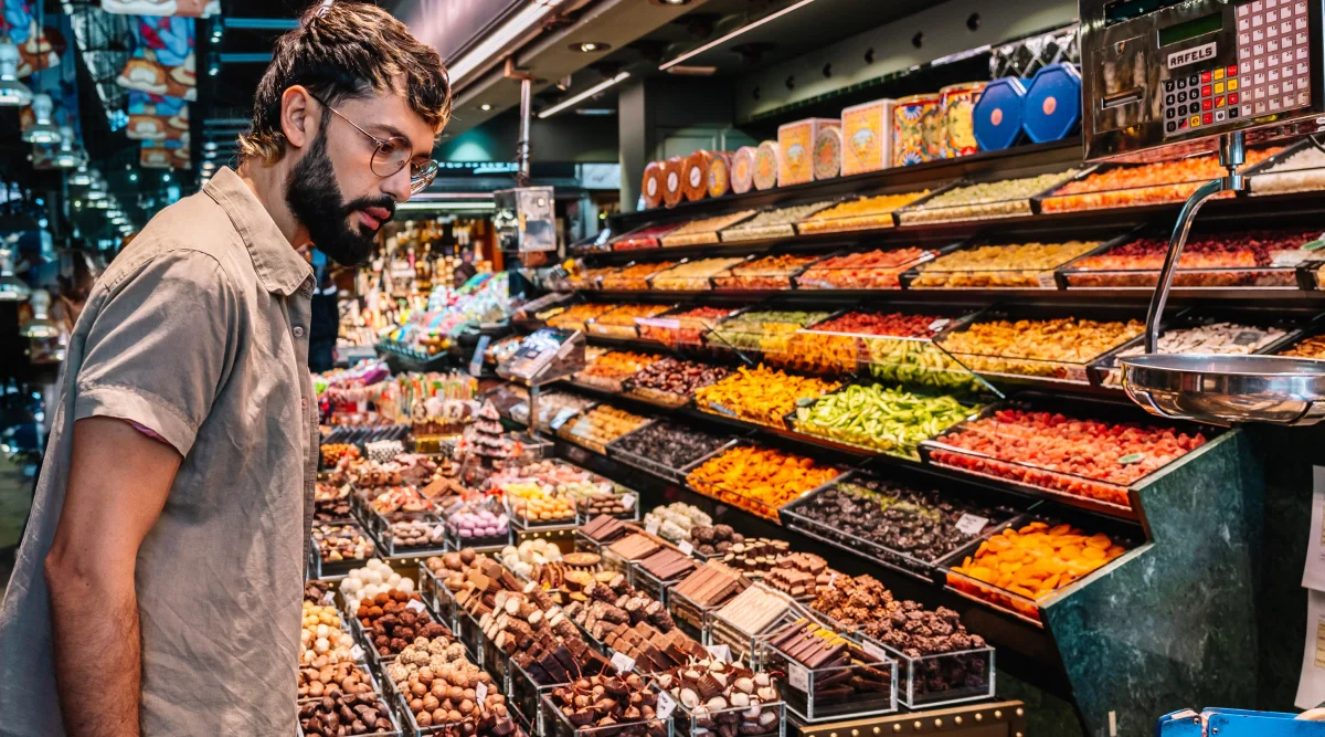 A candy store owner checks on his invention to keep candy fresh. He would like to patent his invention but needs to do a patent search first.