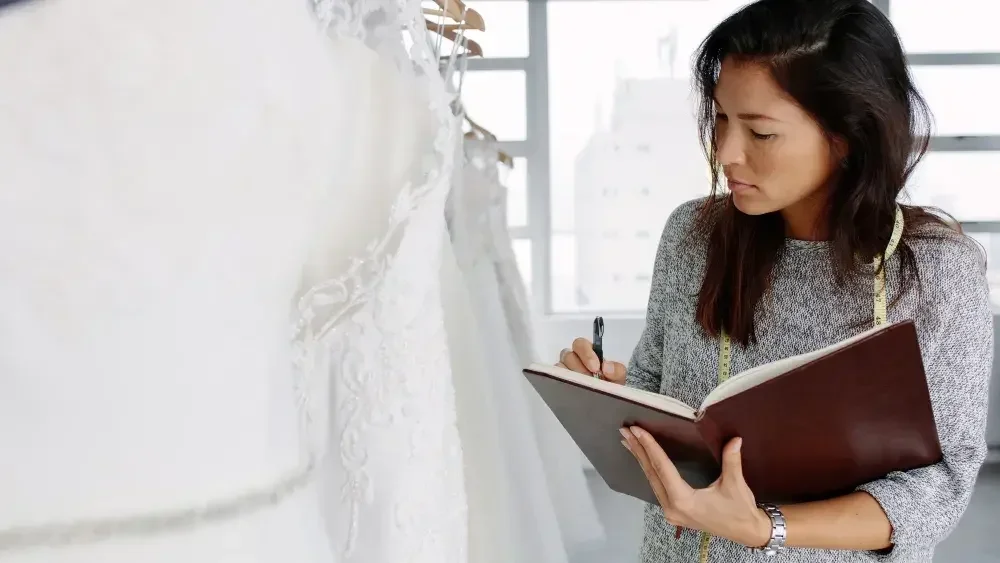 A woman who owns a bridal shop in Illinois takes inventory.