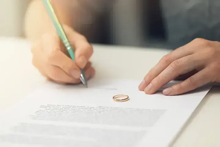 A woman writing her estate plan.