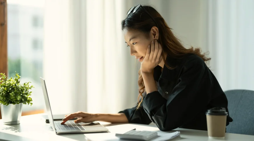 Woman on her computer researching how to get an EIN