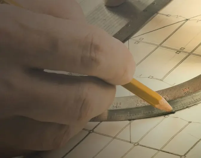 Person working with scale and a pencil