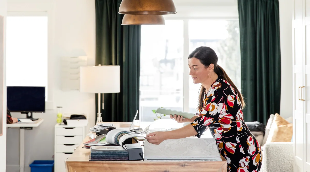 Woman organizing papers at a desk