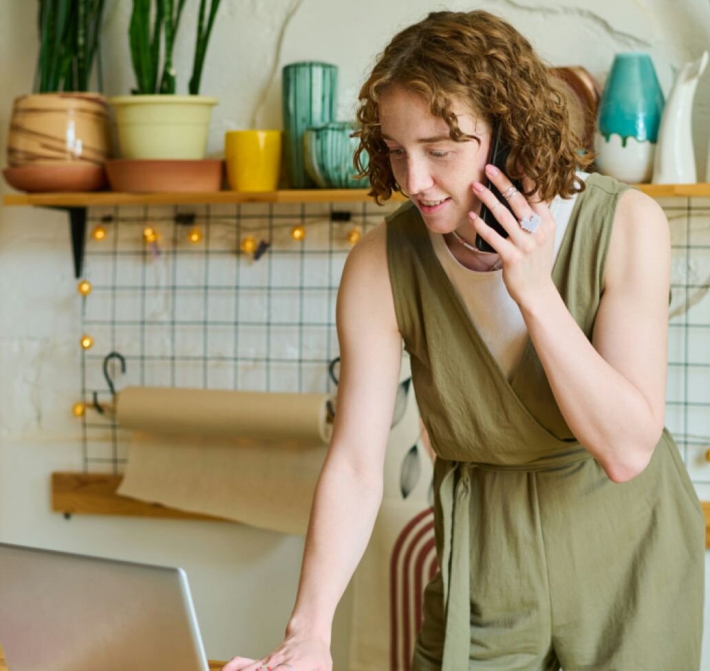 A young women answers calls in her hip office