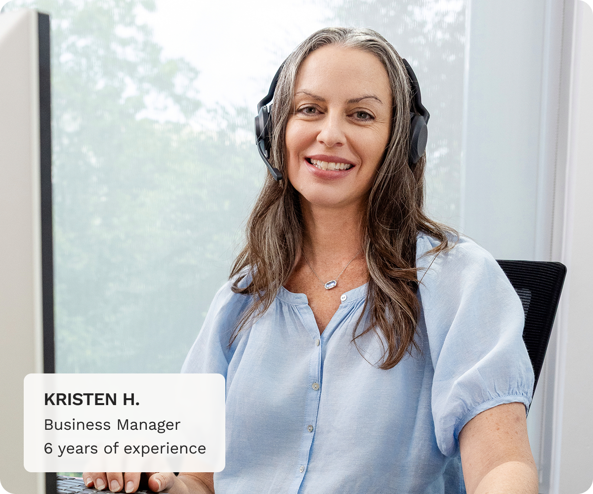 Kristen H. Business Manager with 6 years of experience sitting at a desk.