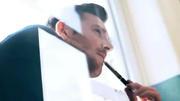 caucasian man contemplating at home or office