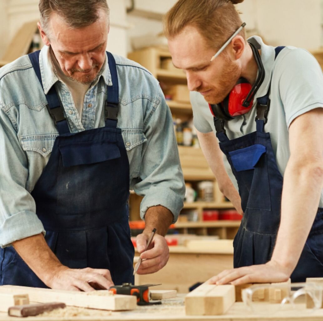 Two men collaborate in their workshop