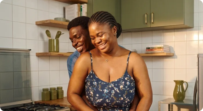 African American family having fun making dinner together