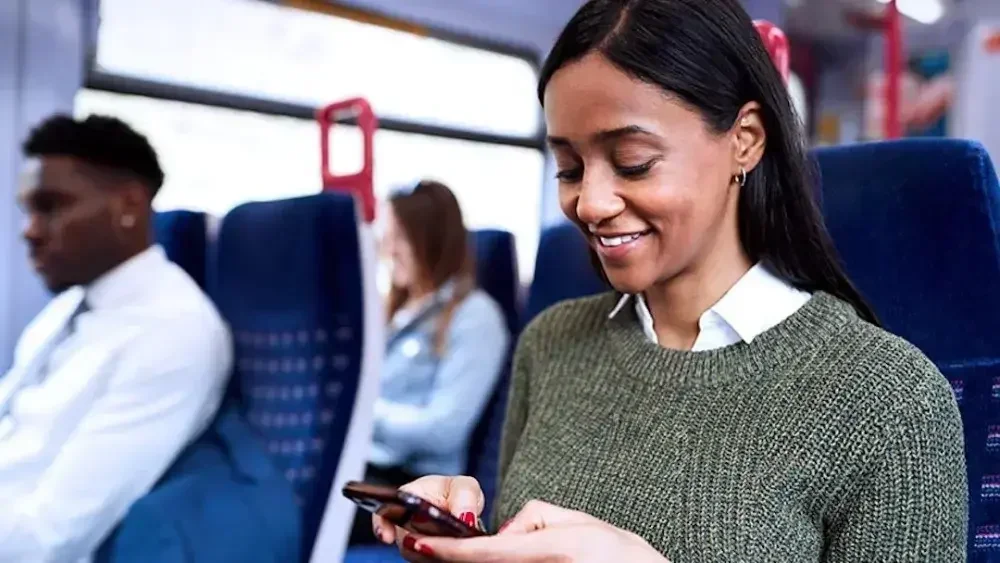 A woman checks on her phone about the trust fund investment, trust gains interest, and how trusts make money.
