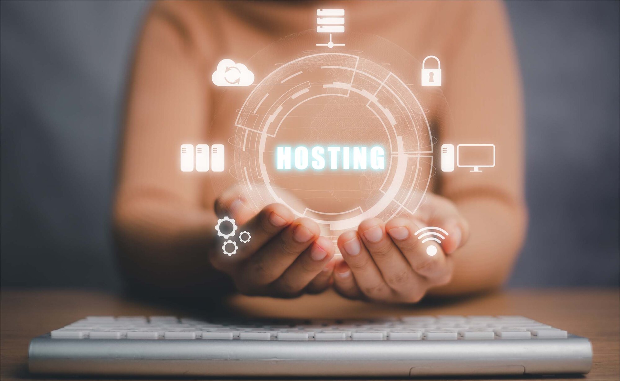 An image displaying all the factors needed to host a website above a keyboard.