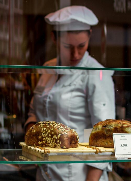 A baker works in a cafe