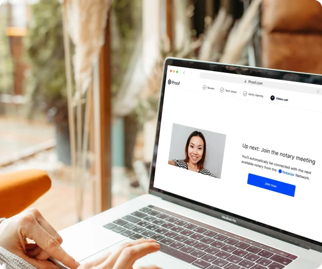 A an image on a laptop of a woman who is available to help with notarization 