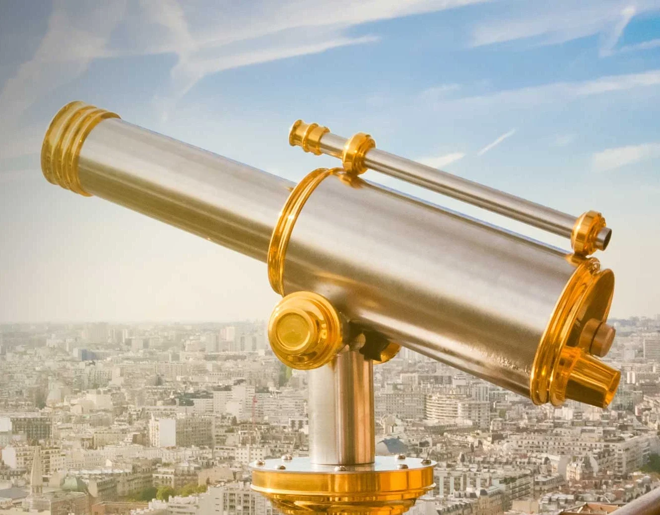 telescope looks over a city