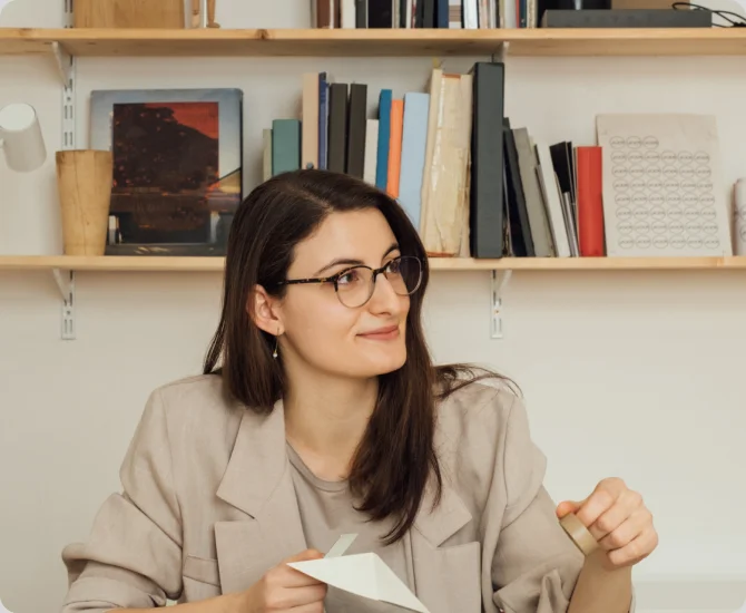 Two women discuss a project in a modern office