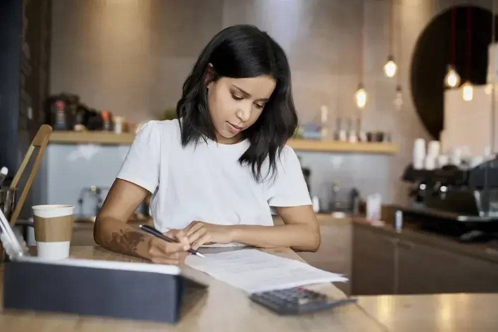 A woman adds the required guardians in her last will and testament for her children.