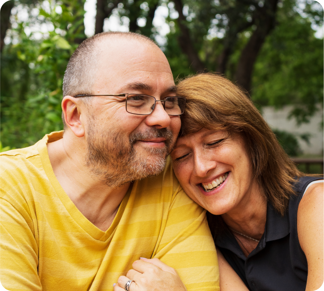 Middle-aged couple embrace in a hug