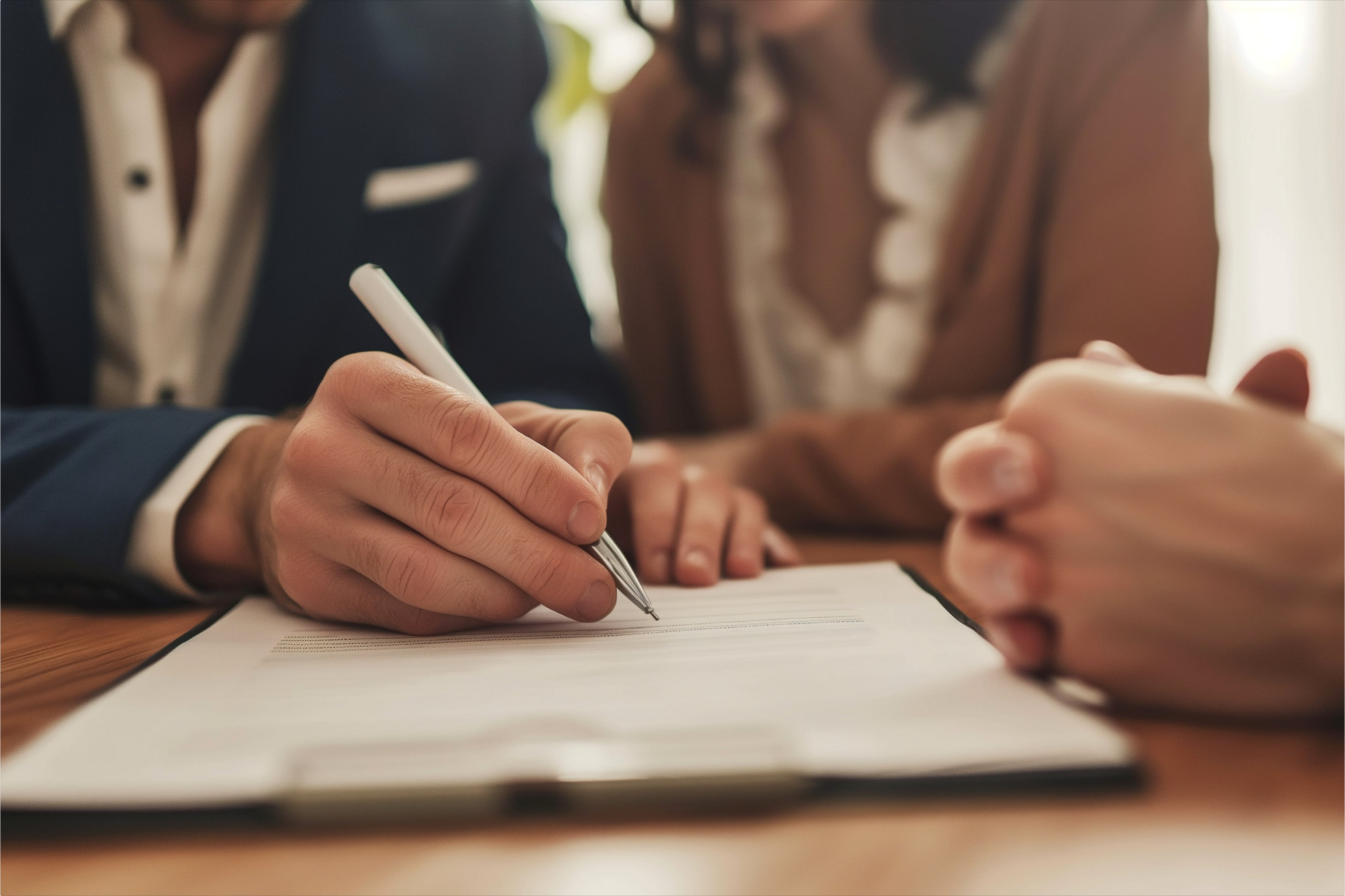 A picture of a man and woman discussing and clarifying their doubts while going through their durable power of attorney papers with a POA service professional.