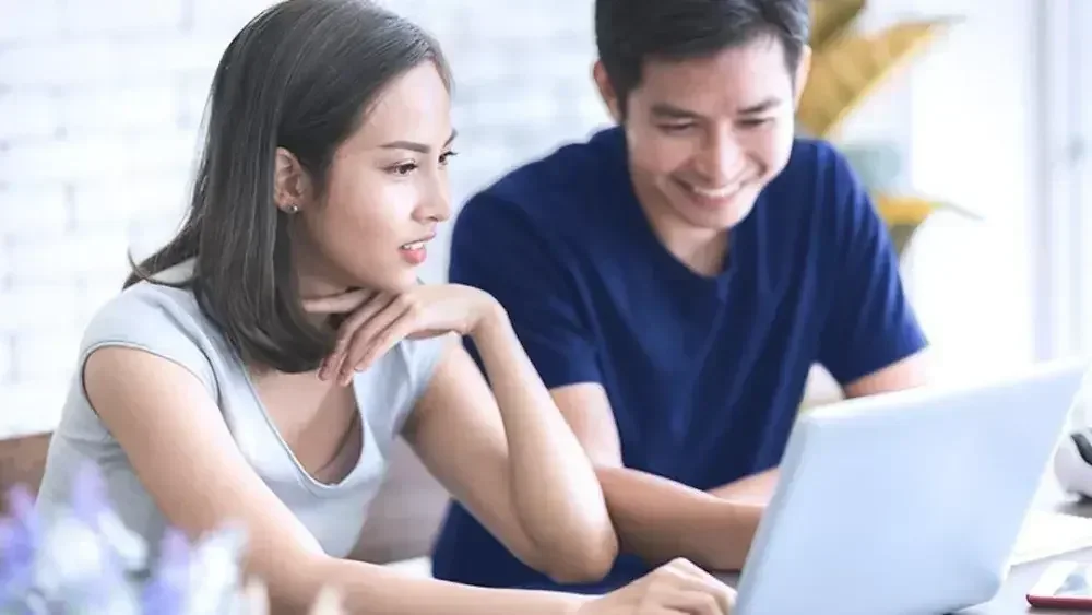 A couple looks over the husband's Texas last will and testament.